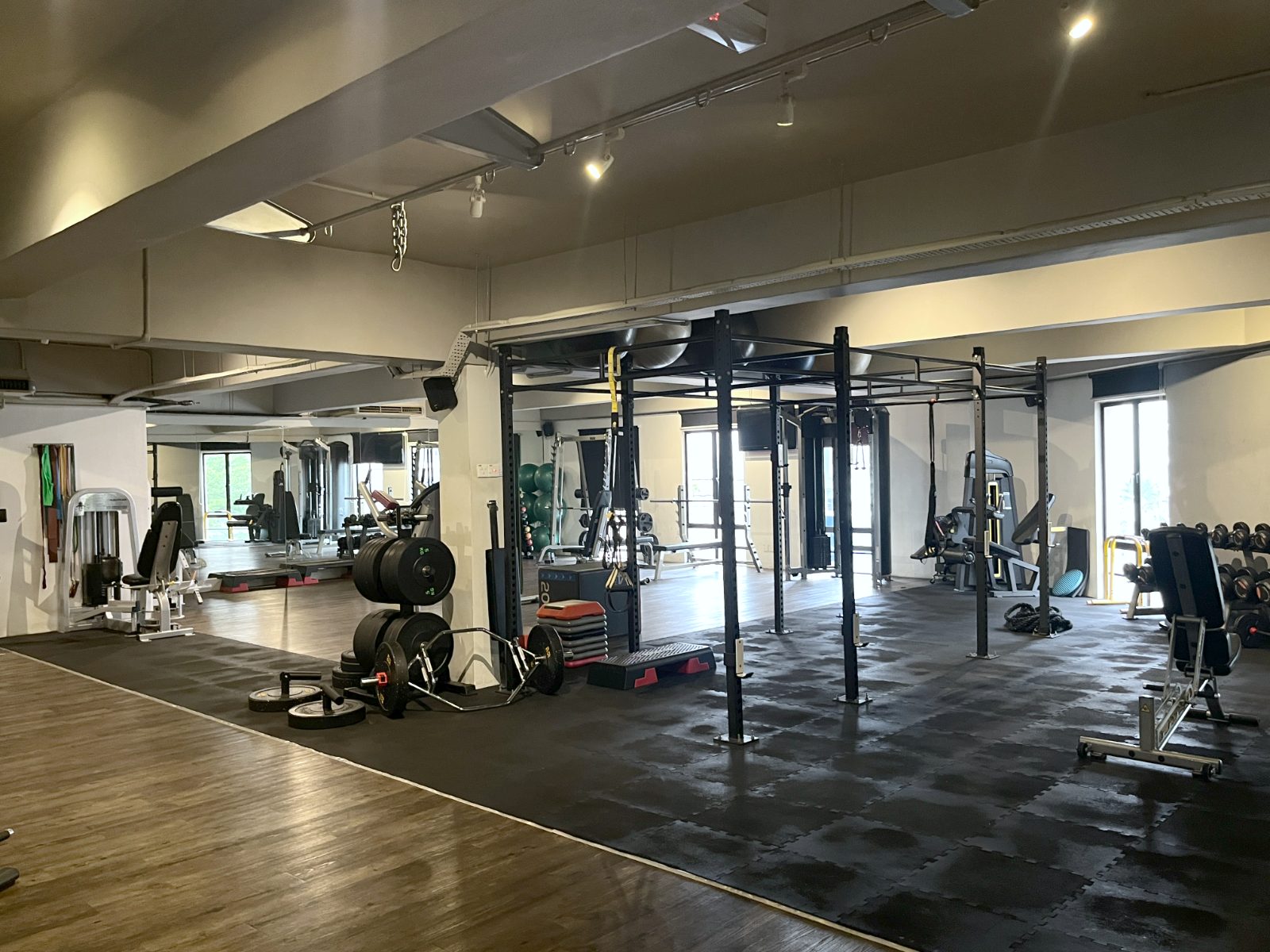 The Body for Life studio floor with squat racks, free weights and machines
